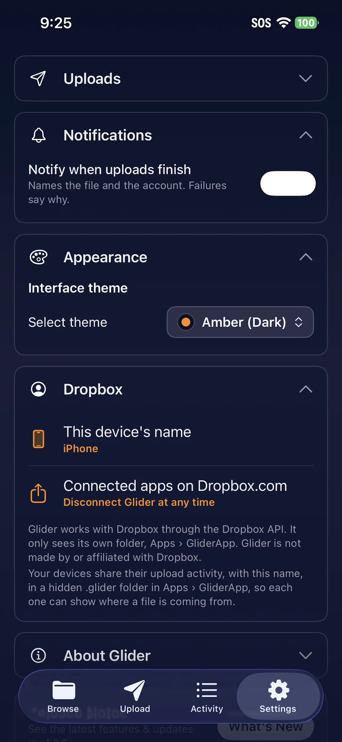 Settings with notifications, the Amber (Dark) theme, this device's name and a link to connected apps on Dropbox.com